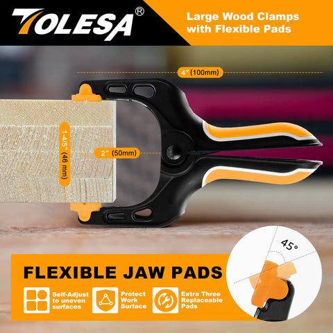 Heavy Duty 4 Inch Spring Clamps Set Of 8 With 30 Lbs Clamping Force, flexible jaw pads on a wood surface