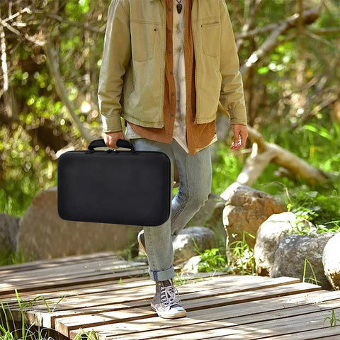 Person carrying Heavy Duty 88 Slot Knife Display Case For 66 Plus Pocket Knives Four Sided Organizer With Large Capacity outdoors