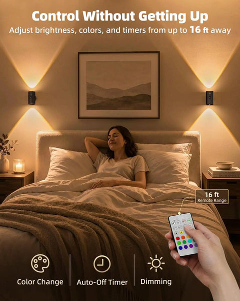 Sleek Wireless Motion Sensor Wall Light Rechargeable LED Sconce With Peels Off Paper Mount illuminating a cozy bedroom with remote control.