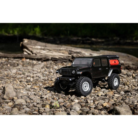 SCX24 Jeep Gladiator One Twenty Fourth Scale 4x4 Rock Crawler Ready To Run Brushed RC Car on rocky terrain