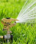Heavy Duty Zinc Alloy Impact Sprinklers 2 Pack With Tough As Nails Build And 360 Degree Adjustable Spray Arc Making Backyard Irrigation Easy Peasy With Smooth Half Inch NPT Hookups For Any Patio Rig watering grass with a spray arc.