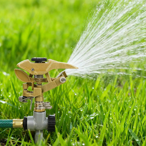 Heavy Duty Zinc Alloy Impact Sprinklers 2 Pack With Tough As Nails Build And 360 Degree Adjustable Spray Arc Making Backyard Irrigation Easy Peasy With Smooth Half Inch NPT Hookups For Any Patio Rig watering grass with a spray arc.