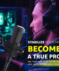 Person using microphone shock mount for 48 to 51mm condenser mics with noise isolation and anti-vibration in home studio.