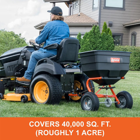 Tow Behind Lawn And Garden Broadcast Spreader With 185 Lb Capacity, Tackles Seed Fertilizer Salt Ice Melt, 12 Ft Spread in use