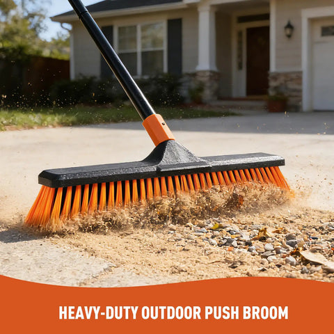 18 Inch Push Broom Outdoor Heavy Duty Beast for Garages, Driveways, and Decks sweeping dirt on concrete surface