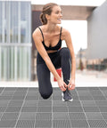 Woman tying shoes on Interlocking Drainage Floor Tiles No Slip With Drain Holes For Pool Bathroom Shower Patio Boat And Pet Areas 12 Inch
