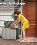 Woman placing package into 50 Gallon Outdoor Storage Box Weatherproof Resin Deck Box With Reinforced Lid That Doubles As A Patio Bench And Side Table, Ideal For Cushions, Garden Tools, Pool Accessories, Packages, And More, UV Resistant Gray.