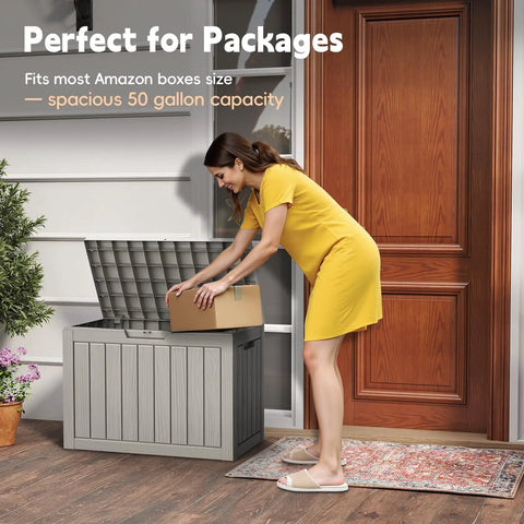 Woman placing package into 50 Gallon Outdoor Storage Box Weatherproof Resin Deck Box With Reinforced Lid That Doubles As A Patio Bench And Side Table, Ideal For Cushions, Garden Tools, Pool Accessories, Packages, And More, UV Resistant Gray.