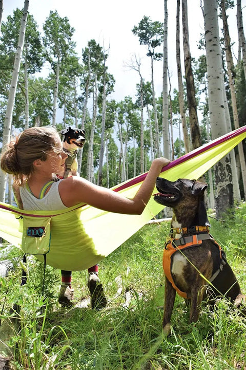 Person in a Lightweight One Person Portable Hammock For Camping Hiking Backpacking Travel Festivals And The Beach Seafoam Navy Color