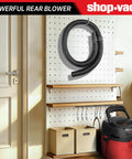 Beefy 4 Ft Vacuum Hose 1-1/4 Inch Diameter, displayed on a workshop pegboard, universal fit, black, for wet/dry vacuums.