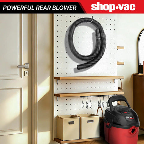 Beefy 4 Ft Vacuum Hose 1-1/4 Inch Diameter, displayed on a workshop pegboard, universal fit, black, for wet/dry vacuums.