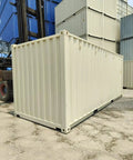Custom Built Walk In Cold Storage Container With A Badass Commercial Refrigeration Setup And Clean Stainless Steel Interior For Rock Solid Frozen Inventory Holding, beige exterior in storage yard.