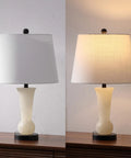 23 Inch Natural Alabaster Table Lamp With Crystal Base Sleek Modern Nightstand Light Featuring White Linen Shade Brass Gold Accents LED Bulb Included The Go To Lighting For Living Room Or Bedroom Energy Efficient Dope Vibe, lit and unlit on wood surface