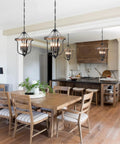 Farmhouse 4 Light Cage Chandelier With Black Metal Finish And Faux Wood Rustic Lantern Pendant Light in cozy kitchen