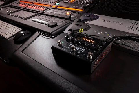 TONEX Pedal Ultra Realistic Stereo Multi-Effects For Guitar And Bass With 150 Gig-Ready AI-Powered Presets on studio desk
