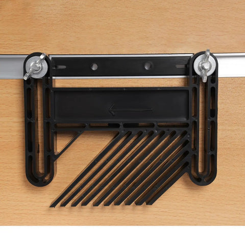 Detail of adjustable guide on portable benchtop router table for routing precision in woodworking projects.