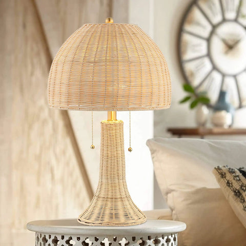 Bohemian Rustic 22 Inch LED Table Lamp With Natural Rattan Shade And Brass Gold Finish on nightstand in cozy bedroom