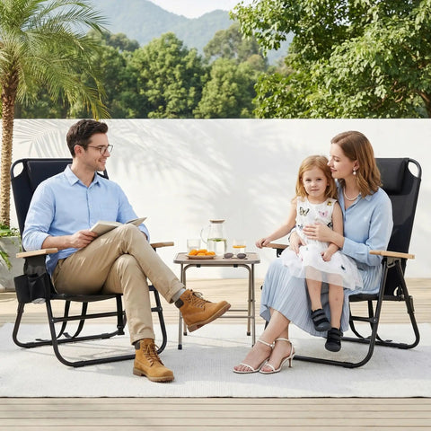 Family sitting on Two Pack Portable Beach Chairs For Adults, Lightweight Outdoor Camping Chairs with Wooden Armrests, outdoors.