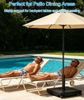 Heavy Duty Umbrella Base With Wheels Holds Up To 200 Lbs next to poolside with chaise lounges.