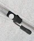 Close-up of Zipper Repair Kit With Quick Fix Zipper Set Replacement Heads And Plier Seam Ripper for coats and jackets in use.
