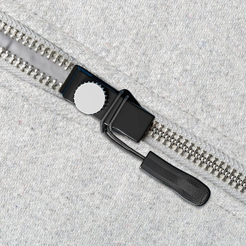 Close-up of Zipper Repair Kit With Quick Fix Zipper Set Replacement Heads And Plier Seam Ripper for coats and jackets in use.