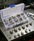 Top Tier 45 Piece Metric Carbon Steel Grease Fittings Kit With M6 M8 And M10 Straight Nipple Caps For Leakproof Hydraulic And Transmission Systems Ready For Any Tough Workshop Job. Open case with assorted metric grease fittings on metal bench