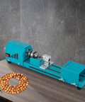 Compact Wood Lathe Machine Featuring 96 Watt Copper Motor Adjustable 4000 To 9000 Rpm Speed Aluminum Build And Dead Simple Controls on a table with beads.