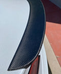 Real Molded Carbon Fiber Matte Dry Look Spoiler For Tesla Model 3 close-up showing texture and aerodynamic edge.