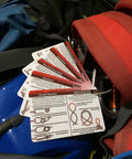 Pocket Climbing Knots Guide For Enthusiasts, waterproof portable cards showing rope knots on a climbing gear background