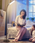 Bright 15W 1000 Lumen LED Floor Lamp With Stepless 3000K To 6000K Color Temperature Fully Dimmable Remote And Touch Control lamp next to woman reading