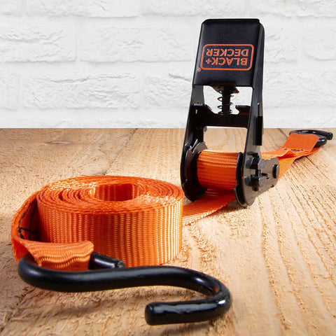 Top Shelf Ratchet Tie Down Straps 1 Inch By 10 Feet 4 Pack with orange strap and black ratchet mechanism on wooden surface.