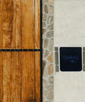 Beefy Iron Roof Cover for Electric Vehicle Charger Keeps Your Level 2 Wall Box Sweet by Blocking Rain Snow and Sun Damage while Offering Universal Fit for Standard Stations and Rock Solid Safety, shown on a wall with wooden and stone panels.