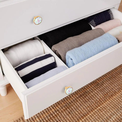 Top Shelf Round Gold Cabinet Knobs And Drawer Pulls Four Pack Sleek Zinc Acrylic Hardware on organized drawer with folded clothes.