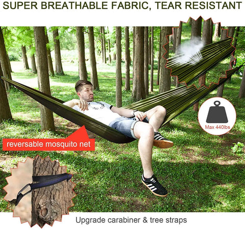 Man relaxing in Go To Camping Hammock With Rain Fly Tarp And Built In Mosquito Net, Tree Straps Included, outdoor forest setting