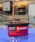 Front view of 237ml Expert Reinforced Metal Filler With Aluminum Reinforcement, auto repair filler in a workshop setting.