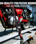 4 Pack Heavy Duty Ratchet Tie Down Straps 1 Inch X 12 Foot 1500 Lbs Breaking Point securing a motorcycle on a trailer ramp.
