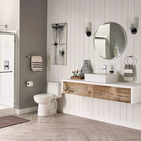 Modern bathroom with Times Square Single Handle Monoblock Faucet In Polished Chrome on vanity next to white sink.