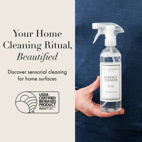 Person holding bottle of Go-To All Purpose Surface Cleaner No 247 Scent That Kicks Dirt On Granite Marble Porcelain And Wood.