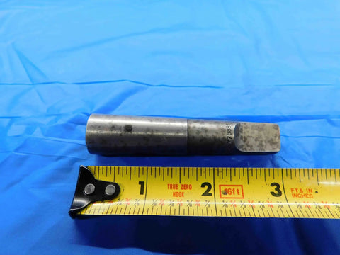 Split Sleeve Driver For One Quarter Inch Hand Tap Morse Taper MT2 Machinist Tool BT3214AB3 on blue background with tape measure