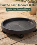Heavy Duty Plant Caddy With Ultra Smooth Rollers, 14 Inch Round Planter Saucer for Indoors and Outdoors on wooden surface.