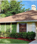 Expandable Fence Privacy Screen For Balcony And Patio No Fuss Installation Faux Ivy Fencing Panel 16x45 To 92 Inches Willow Frame With Decor Ivy Leaves Low Maintenance Backyard Decor installed on a house exterior wall.
