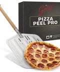 Hans Grill Pizza Peel Pro perforated metal pizza paddle with wooden handle; front view beside packaging box.