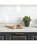 Kitchen scene with Nikki Chu Zulu Signature Peel And Stick Vinyl Wallpaper Roll for easy no mess install; geometric design visible.