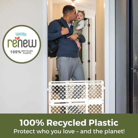 Recycled Plastic Baby Gate Pressure Mounted Doorway Safety Barrier Indoor Outdoor Use No Hassle Setup Keeps Tiny Humans Secure Easy Install Pure White Eco Friendly Non Toxic Build Holds Firm Through Daily Chaos Smooth Sailing in use with parent and baby.