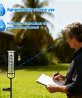 Man observing Solar Powered Glass Weather Station Rain Gauge Garden Stake With Freeze Proof Design Fairy Garden Decor