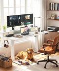 Solid Build Electric Standing Desk With 55x26 Inch Adjustable Height And Clean White Finish Offering Smooth Glide Operation For Ergonomic Monitor Riser Plus Built Drawers Keeping Your Pro Home Office Setup Zero Clutter And Ready To Crush The Daily Grind in a well-lit home office with a golden retriever.