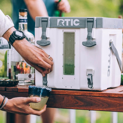 Halftime 3 Gallon Portable Water Cooler Dispenser With Dual Taps Bottleless BPA Free Stackable Hydration Station For Sports Camping BBQ Parties And More White on table