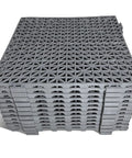 12 Pack Modular Interlocking Cushion Rubber Floor Mats 11.6 Inch Square Tiles For Pool Deck Patio Balcony Yard Pet Area Drainage Wash Pad Gray Non Slip Surface For Wet Areas Durable Flexible And Easy To Install. Stacked gray tiles.