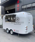 Heavy Duty Polished Mirror Food Trailer With Foldout Awning Fully Customizable Layout, sleek white exterior and kitchen window