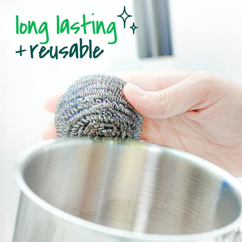Hand using Three Pack Stainless Steel Dish Scrubbers That Power Through Tough Grease And Burnt On Messes Heavy Duty Metal Scrub Pads